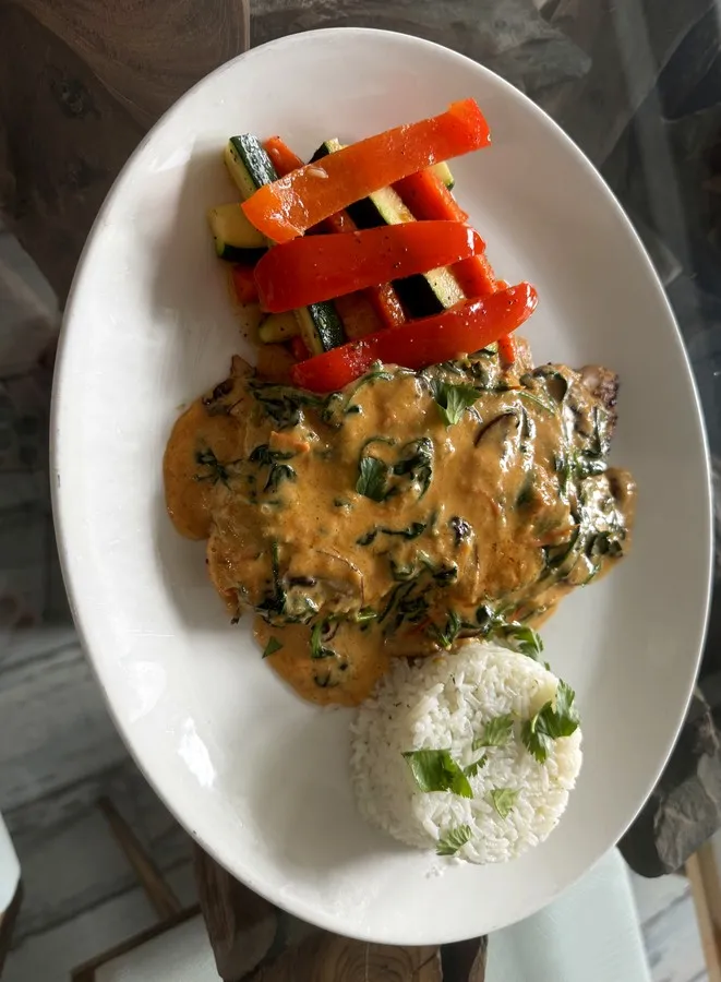 Pollo Agave & Ember, grilled chicken with habanero sauce and sautéed spinach