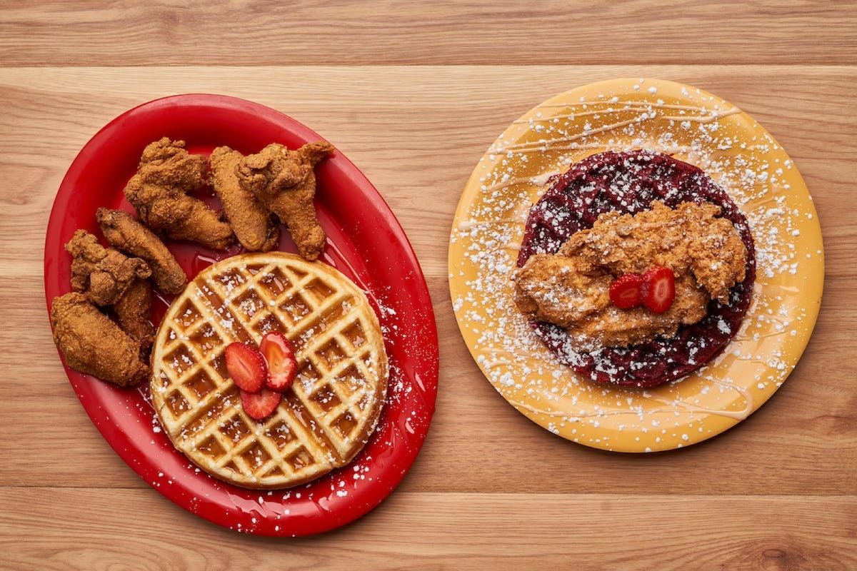 Chicken and golden waffle beside a chicken and red velvet waffle plate