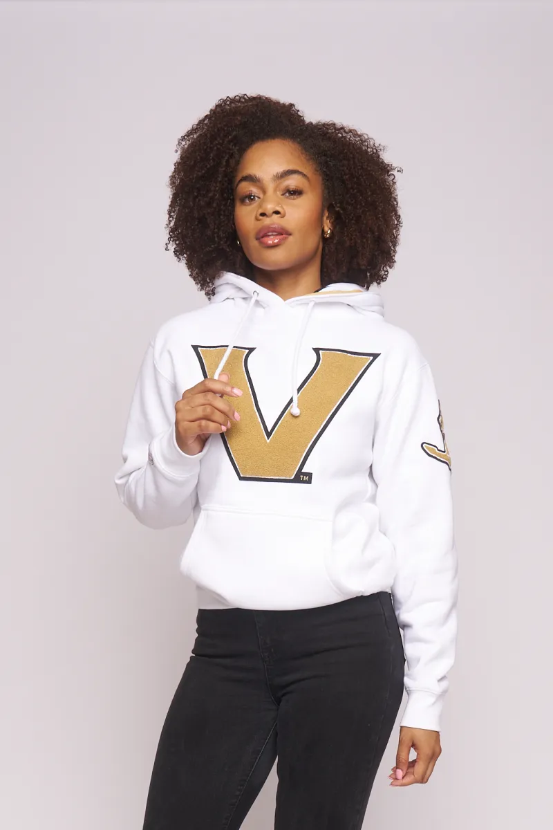 Model in the white and gold Vanderbilt V hoodie